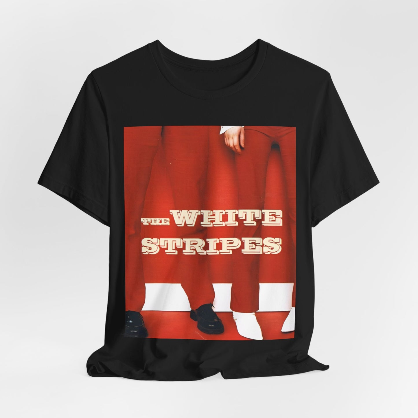 A black graphic t-shirt featuring a red and white signature graphic of The White Stripes.
