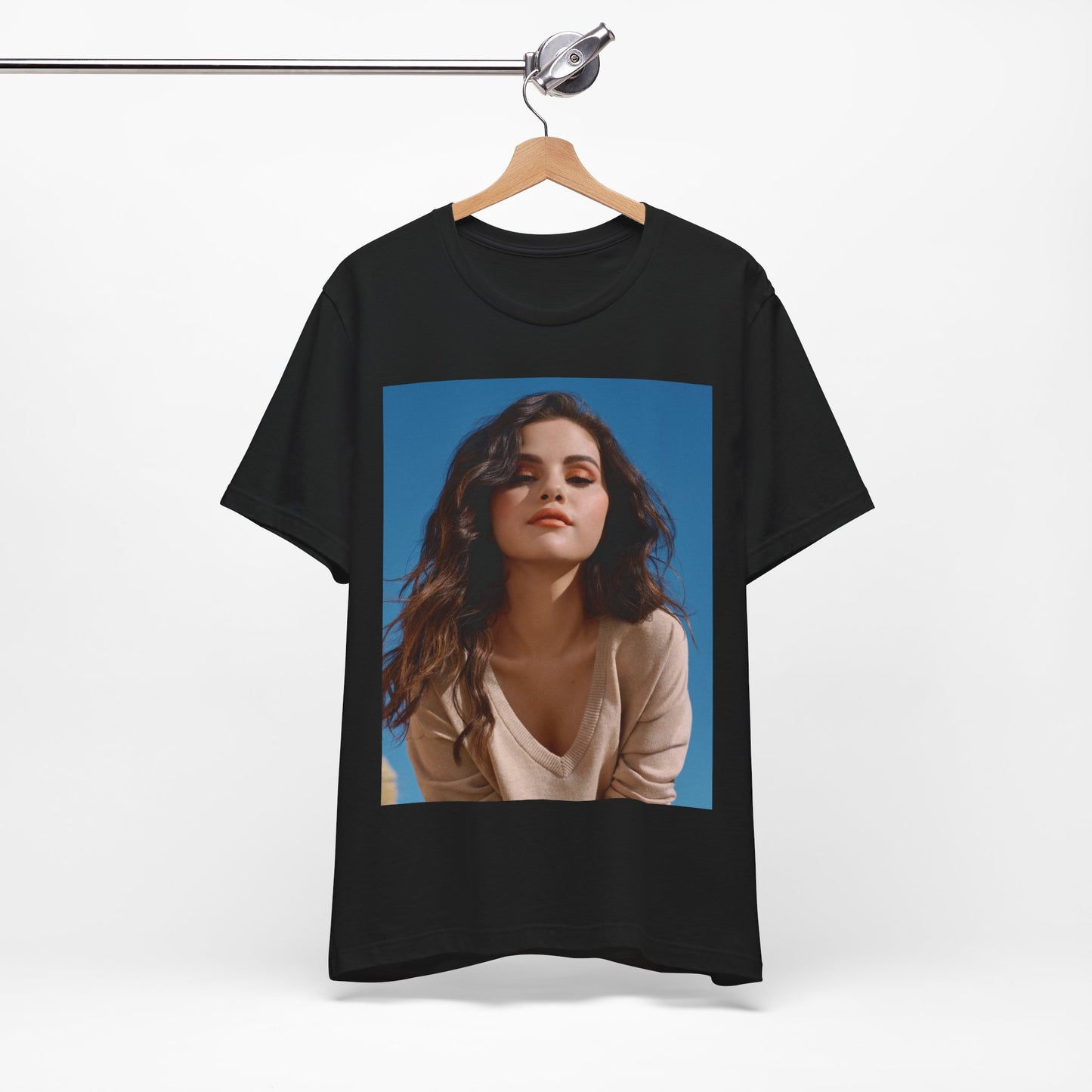 A black graphic t-shirt featuring a vintage pop icon graphic of Selena Gomez.