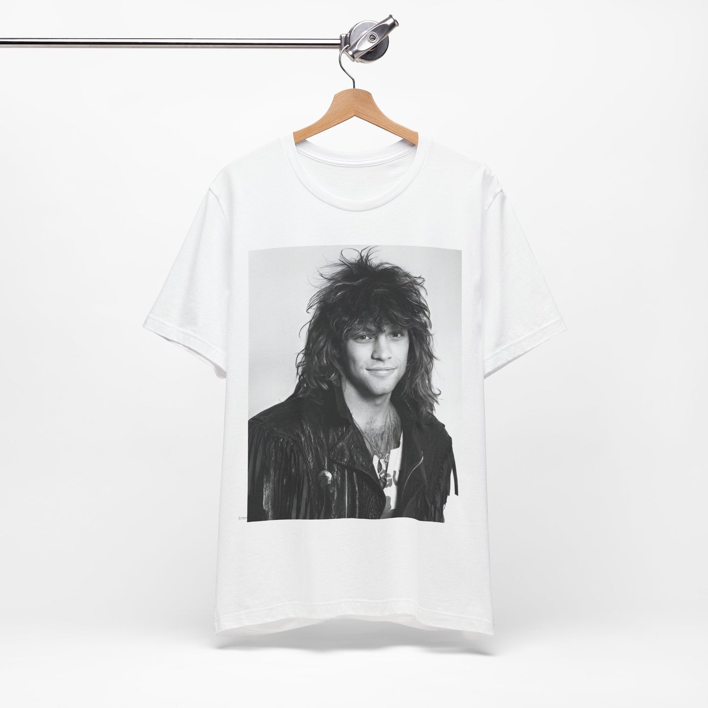 A black graphic t-shirt featuring a black and white photo of Bon Jovi from a 90s tour, performing on stage.