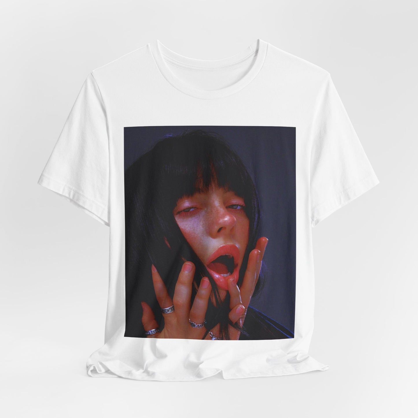 An intense, artistic photo of Billie Eilish with a bloody nose, conveying a sense of raw power, printed on a graphic t-shirt.