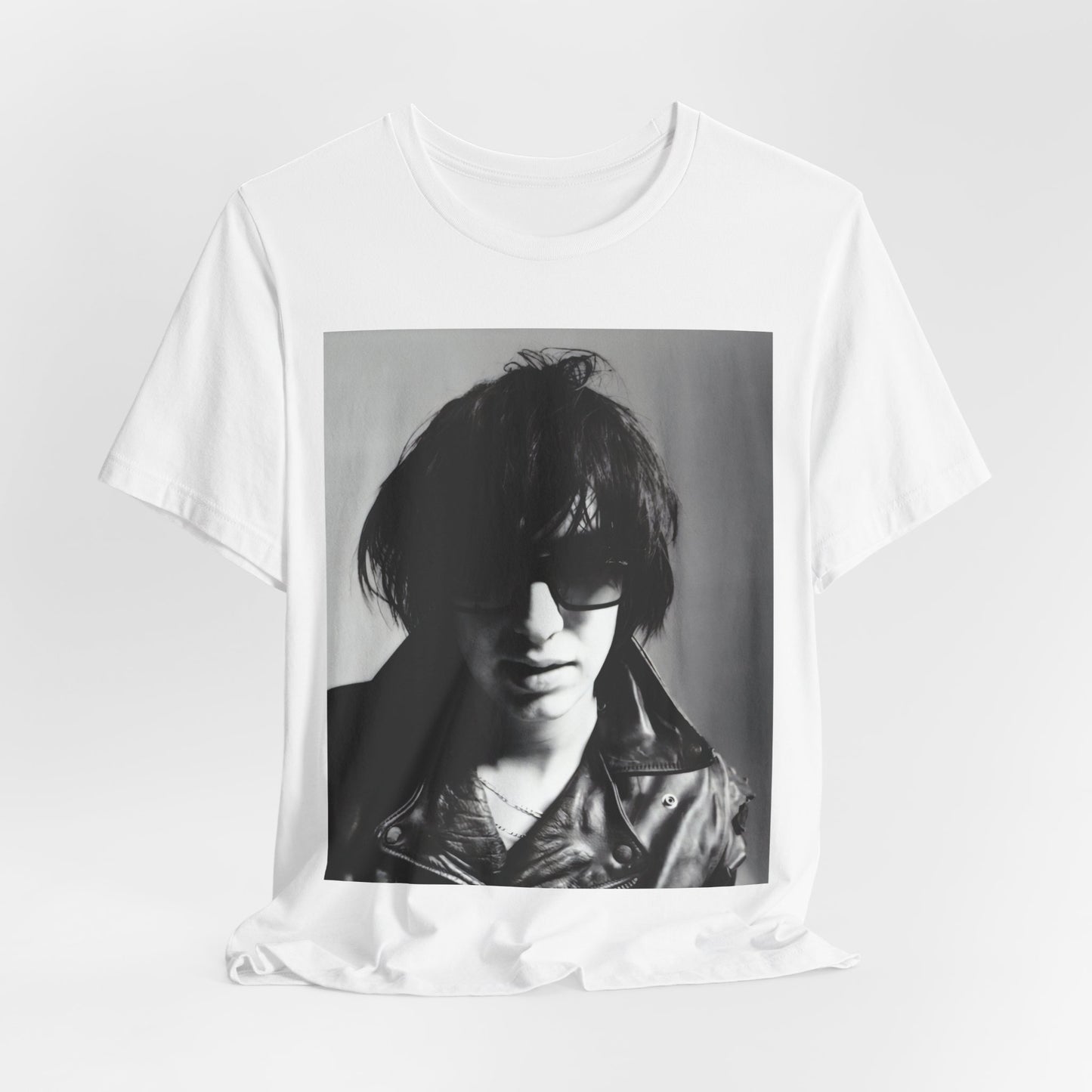 A black graphic t-shirt featuring a graphic related to The Strokes' 'Reptilia' song or era.