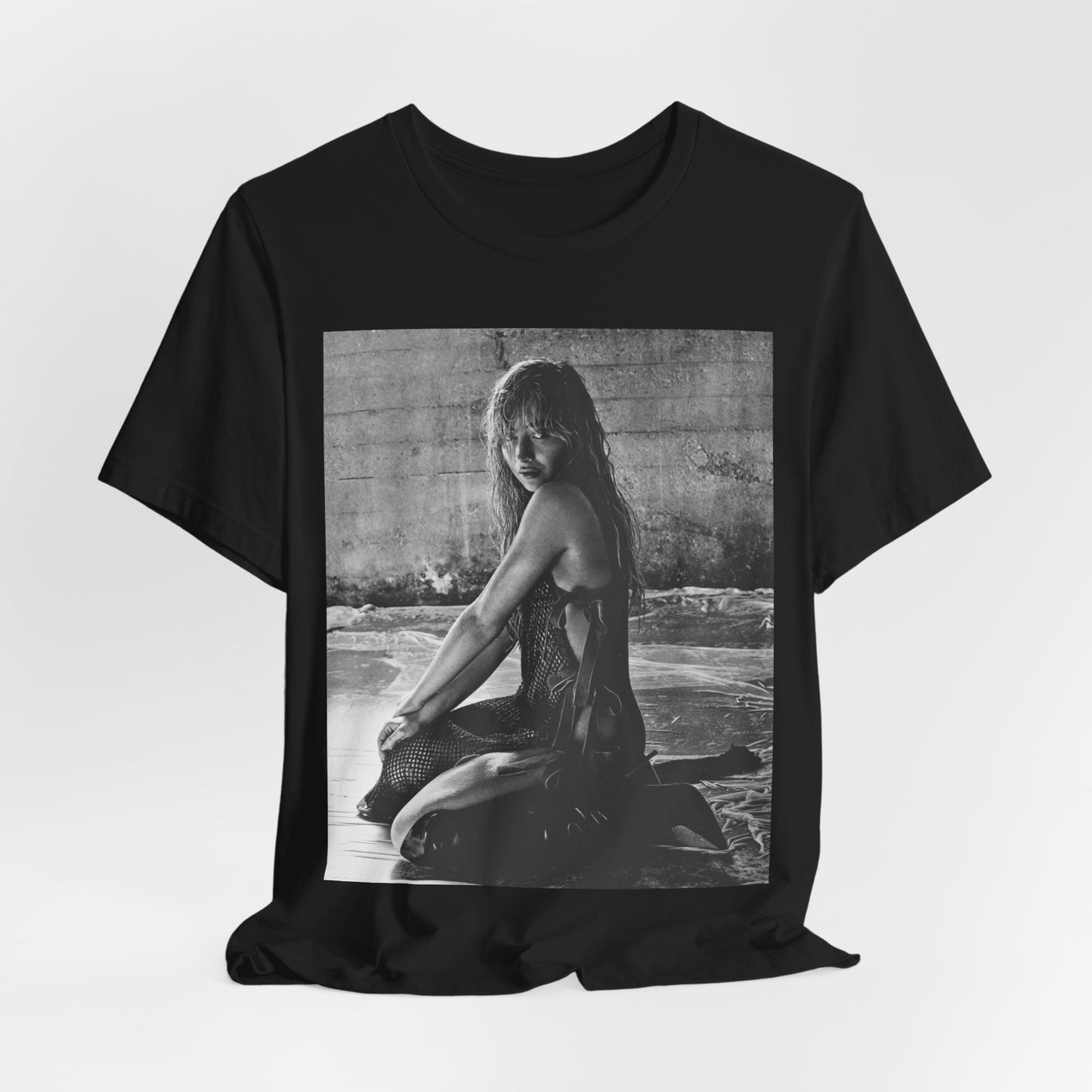 A black graphic t-shirt featuring a black and white, monochrome graphic or photo of Sabrina Carpenter.