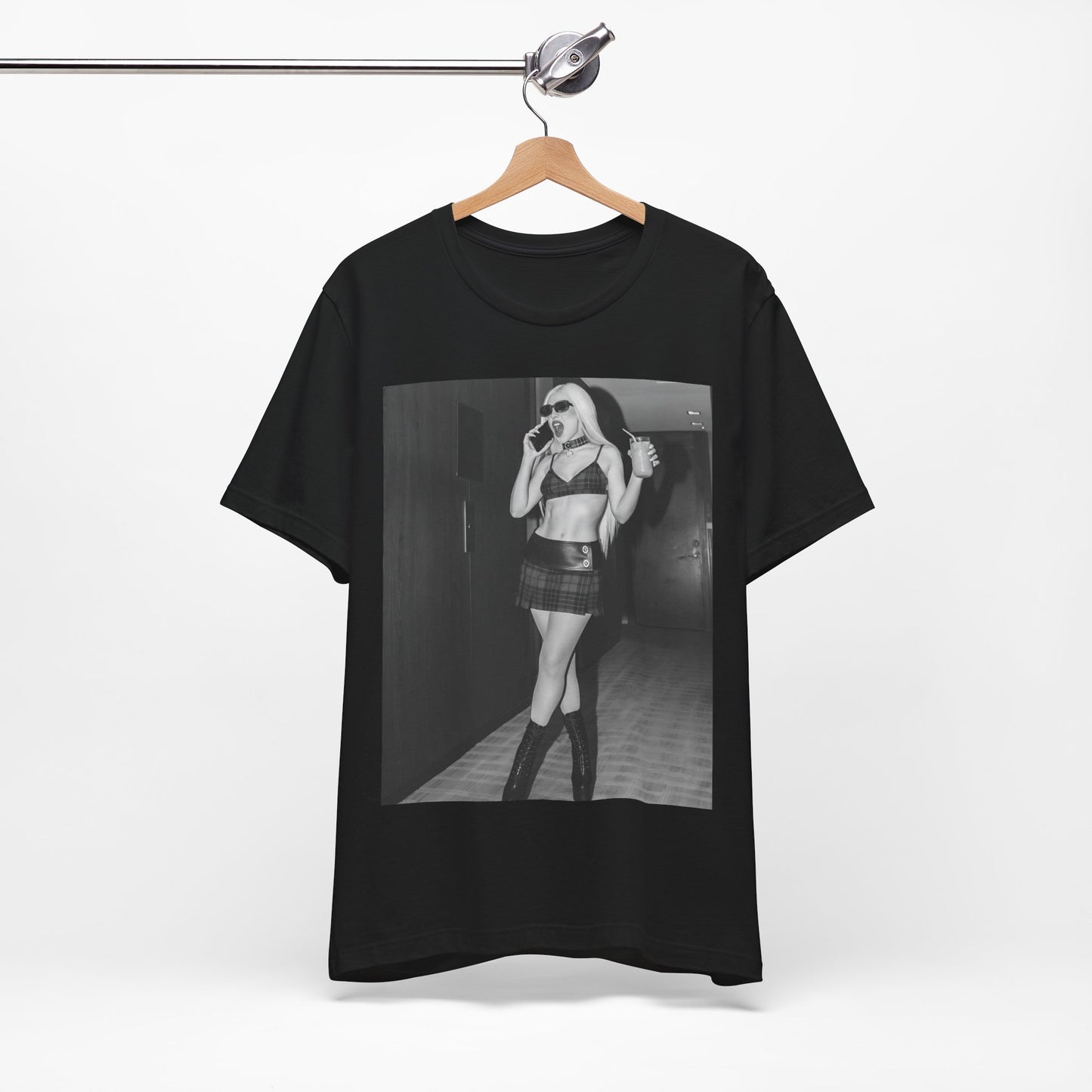 A black graphic t-shirt featuring a graphic of Ava Max with a 'rebel chic' or edgy pop aesthetic.