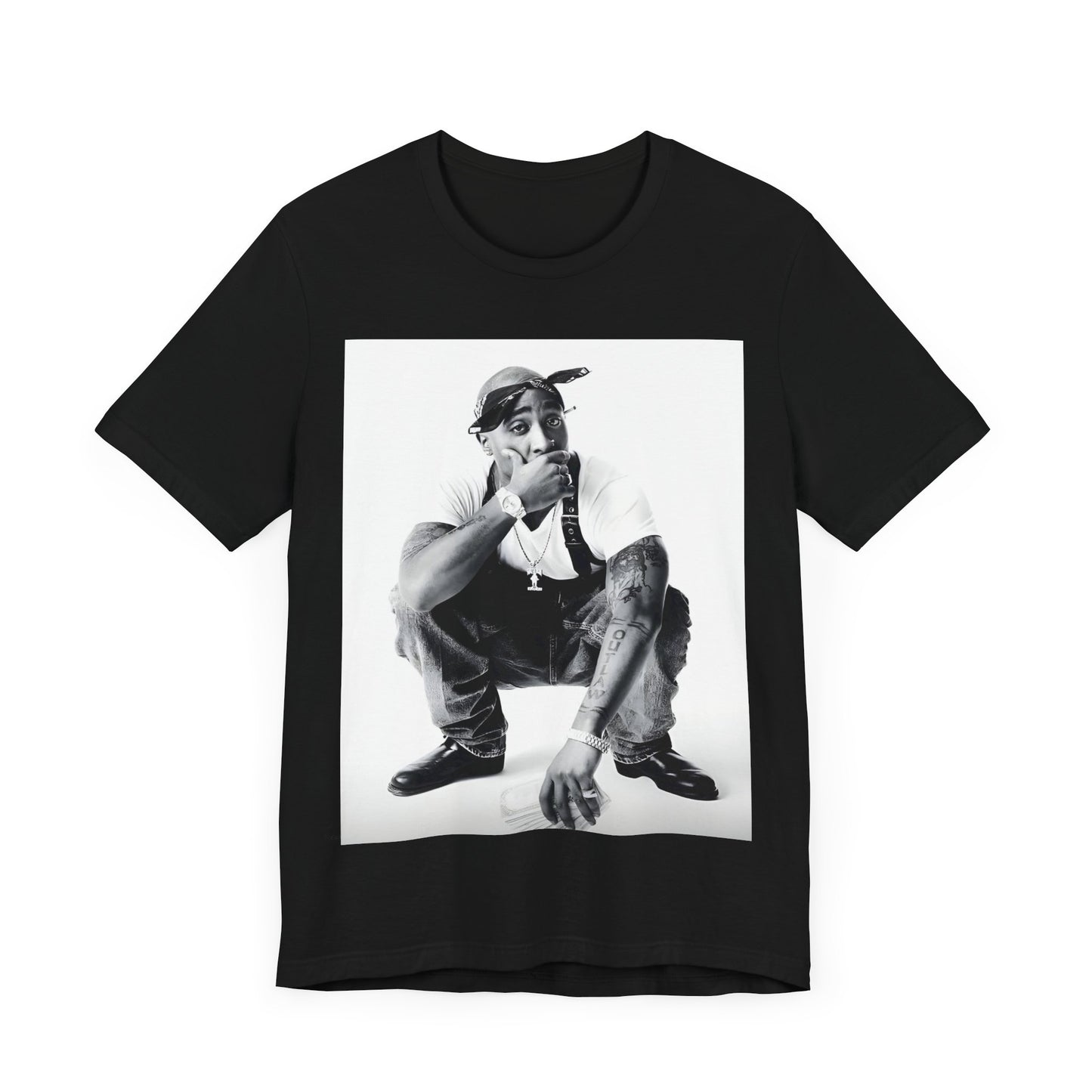 A black graphic t-shirt featuring a graphic of Tupac with a conscious rap vibe.