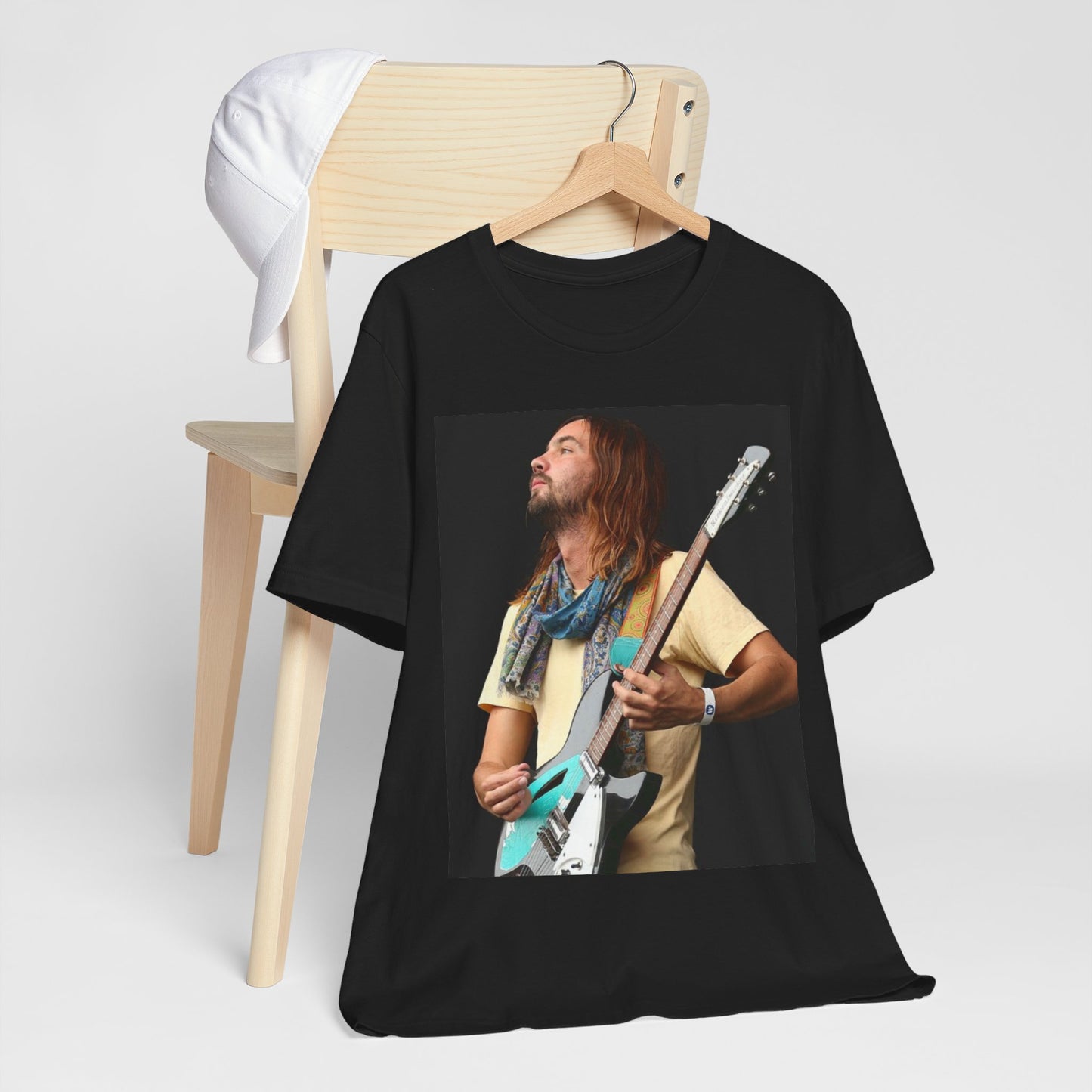 A black graphic t-shirt featuring a vintage indie rock graphic of Tame Impala.