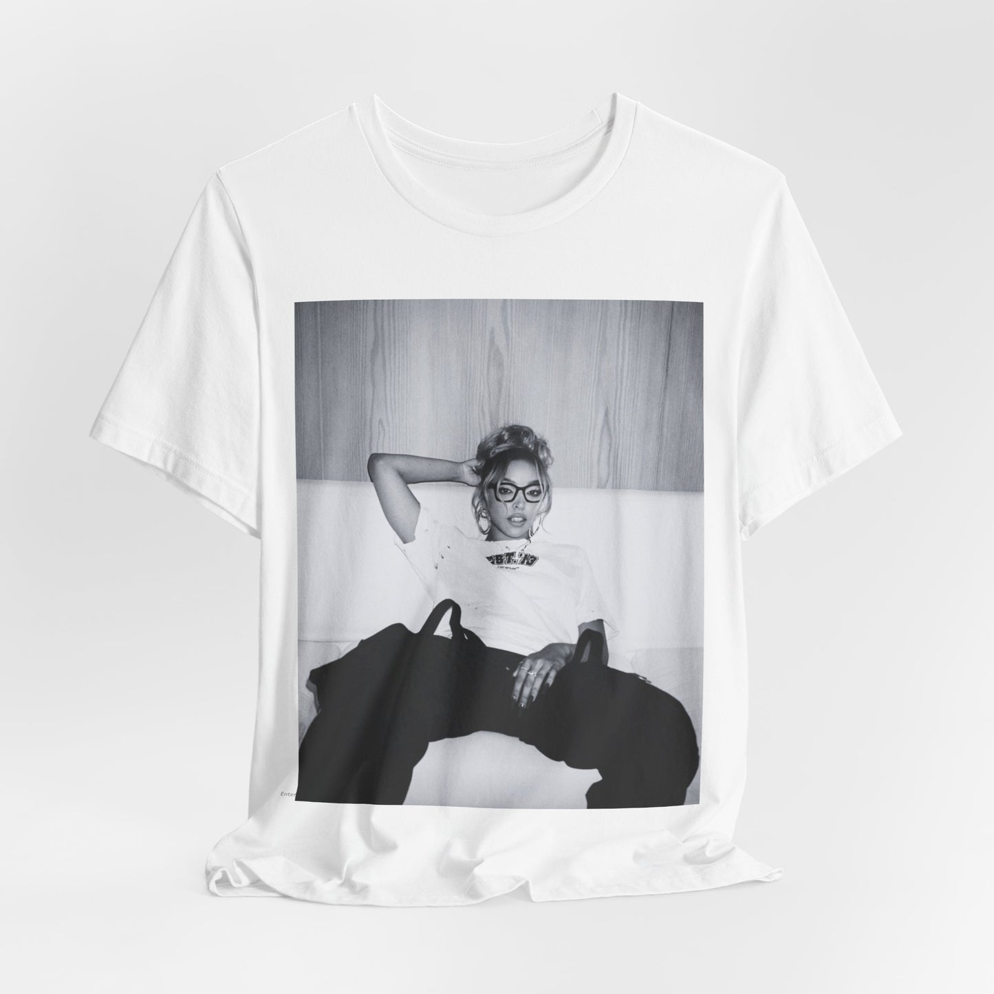 A black graphic t-shirt featuring a black and white portrait photo of Tinashe.