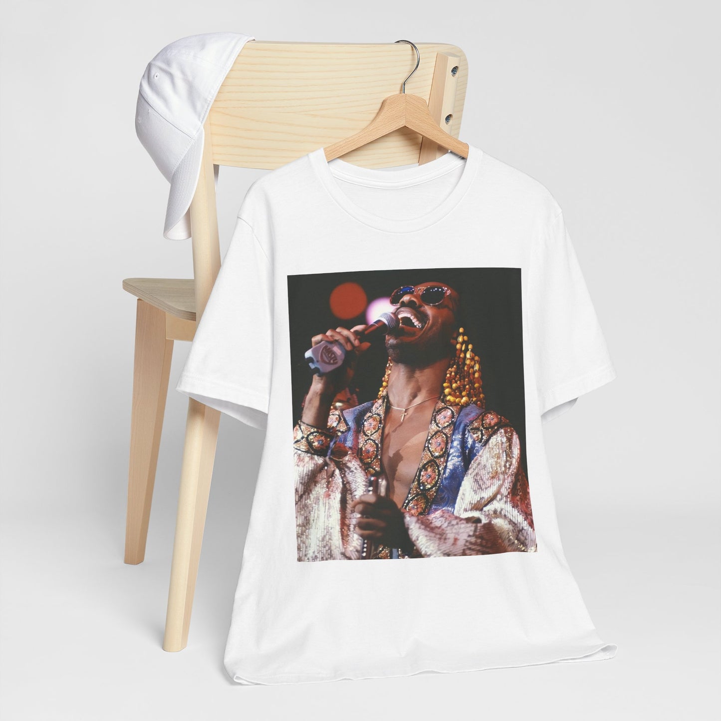 A black graphic t-shirt featuring a 70s vintage soul icon graphic of Stevie Wonder.
