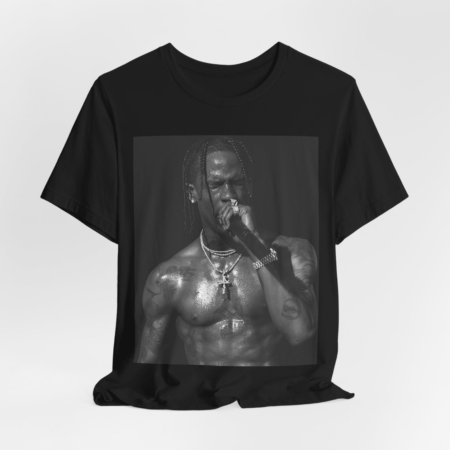 A black graphic t-shirt featuring an underground hip hop graphic of Travis Scott.