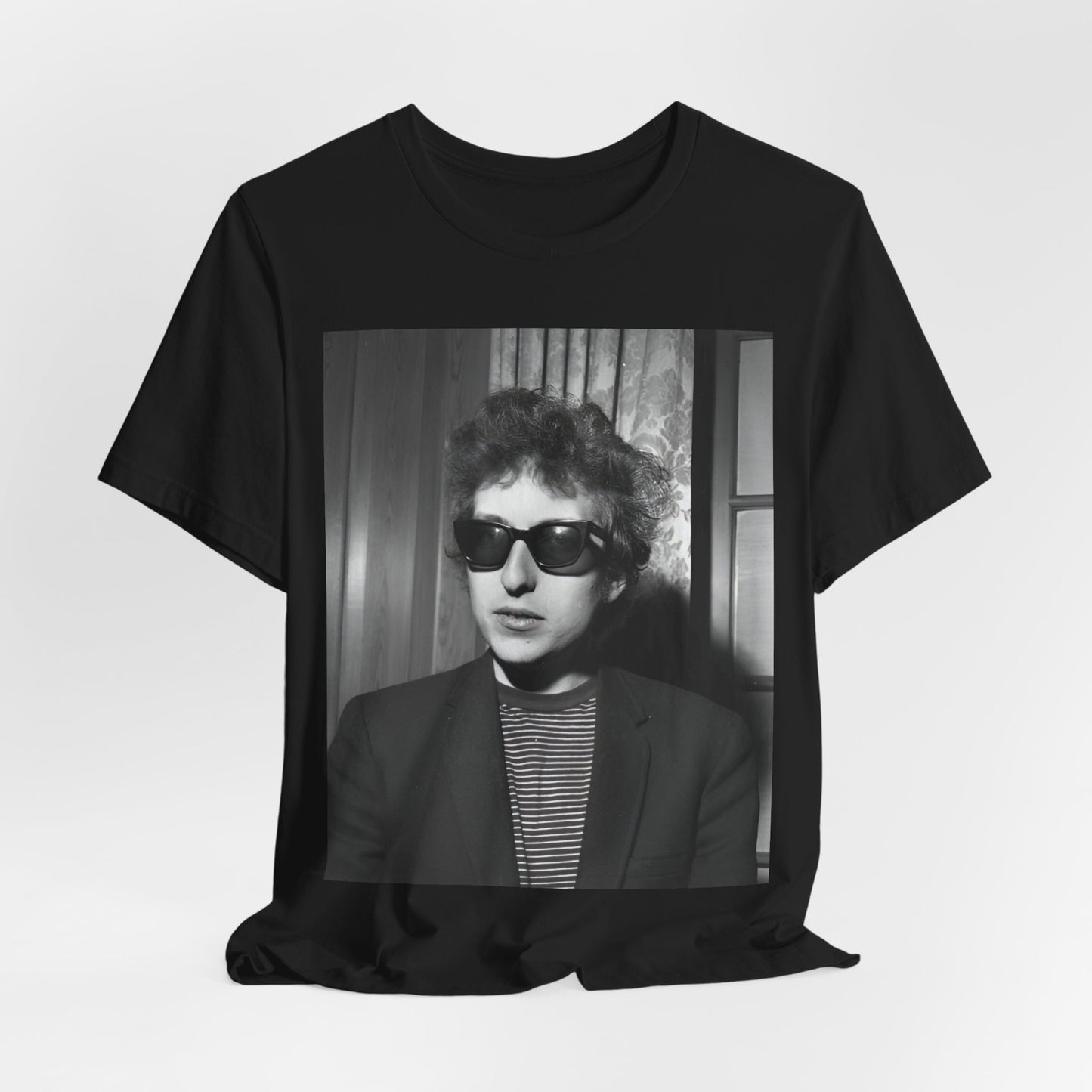 A black graphic t-shirt featuring a graphic related to Bob Dylan's 'The Freewheelin' album era.