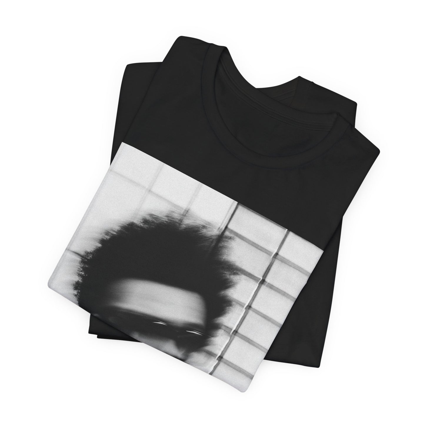 A black graphic t-shirt featuring a blurred graphic of The Weeknd from his 'After Hours' era.