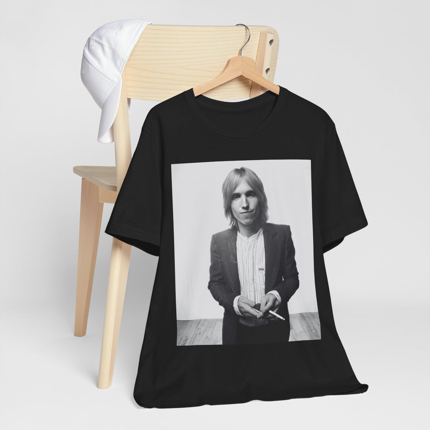 A black graphic t-shirt featuring a graphic of Tom Petty with rock legend vibes.