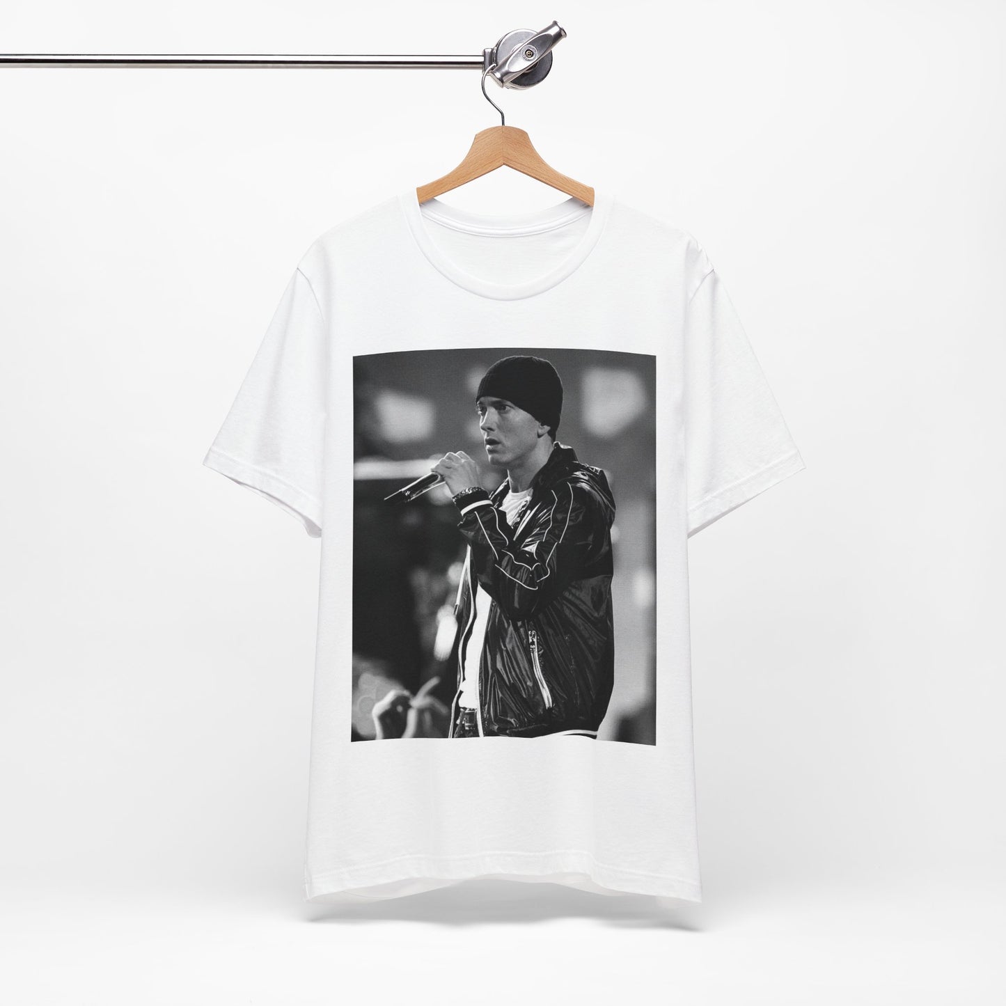 A black graphic t-shirt featuring a classic 90s graphic of Eminem as a 'Rap God'.