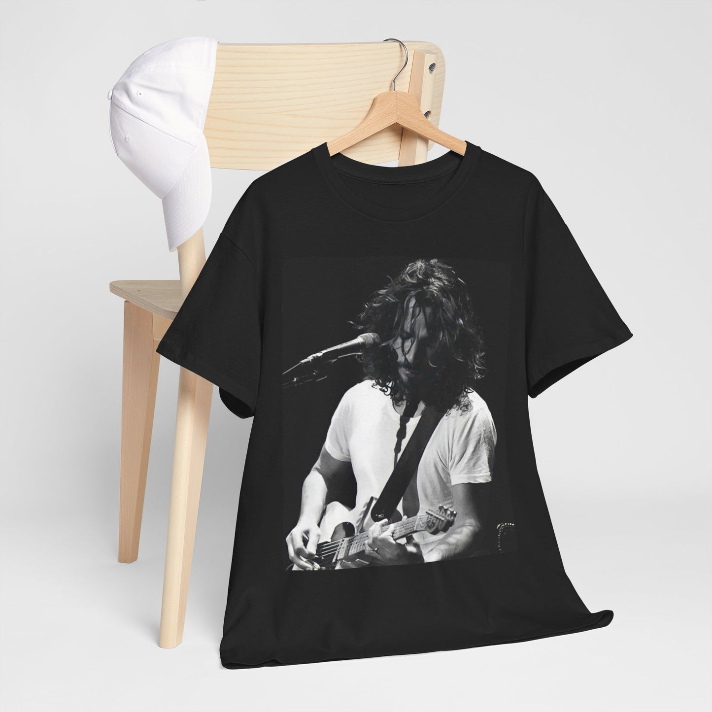 A black graphic t-shirt featuring a 90s-style graphic of Chris Cornell, evoking the Seattle sound aesthetic.