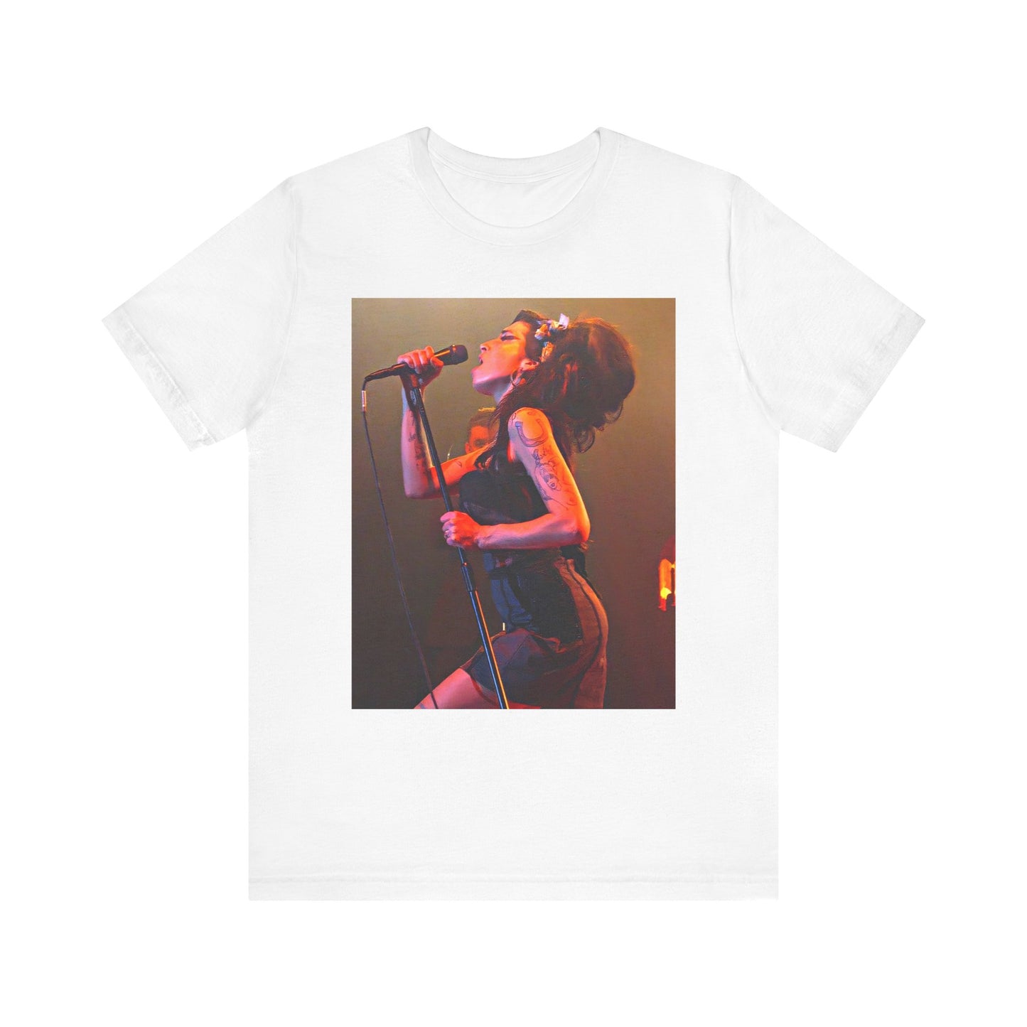 A black graphic t-shirt featuring a dynamic photo of Amy Winehouse performing live, with elements suggesting her 'Back to Black' era.