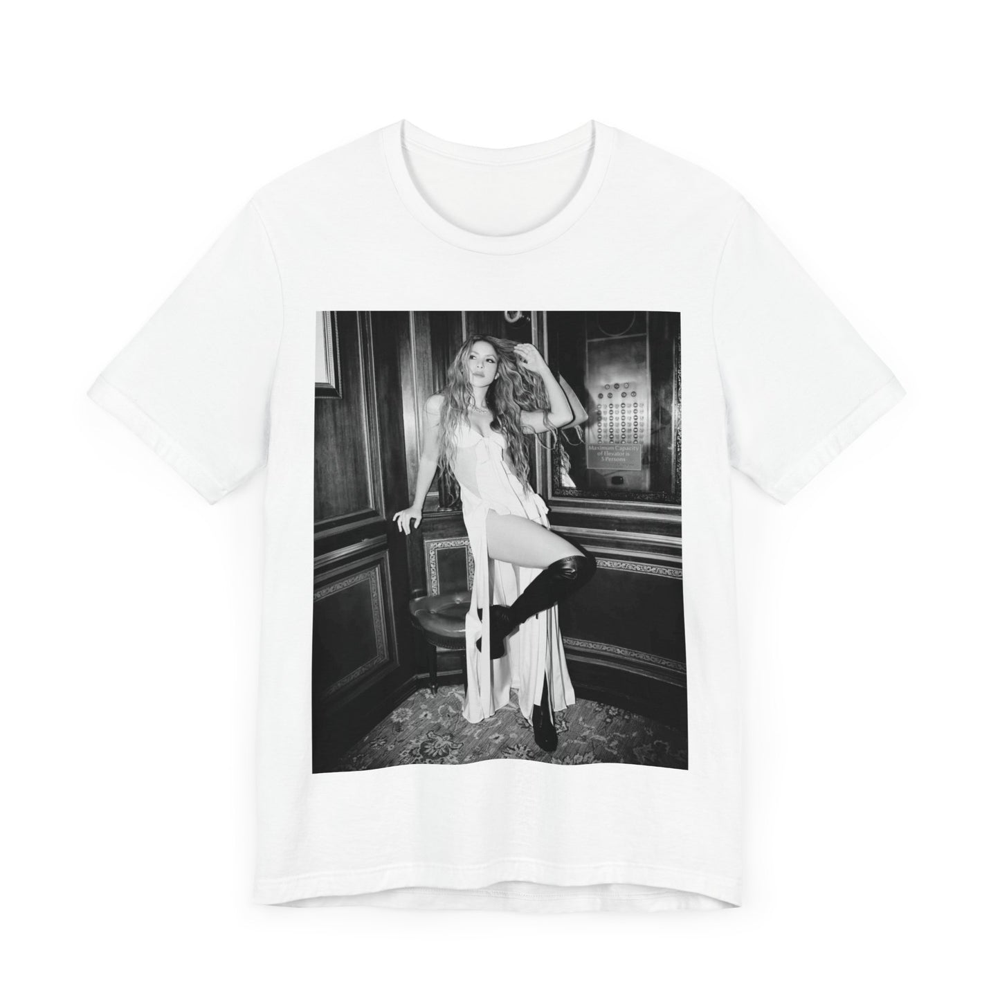 A black graphic t-shirt featuring a retro black and white monochrome graphic or photo of Shakira.