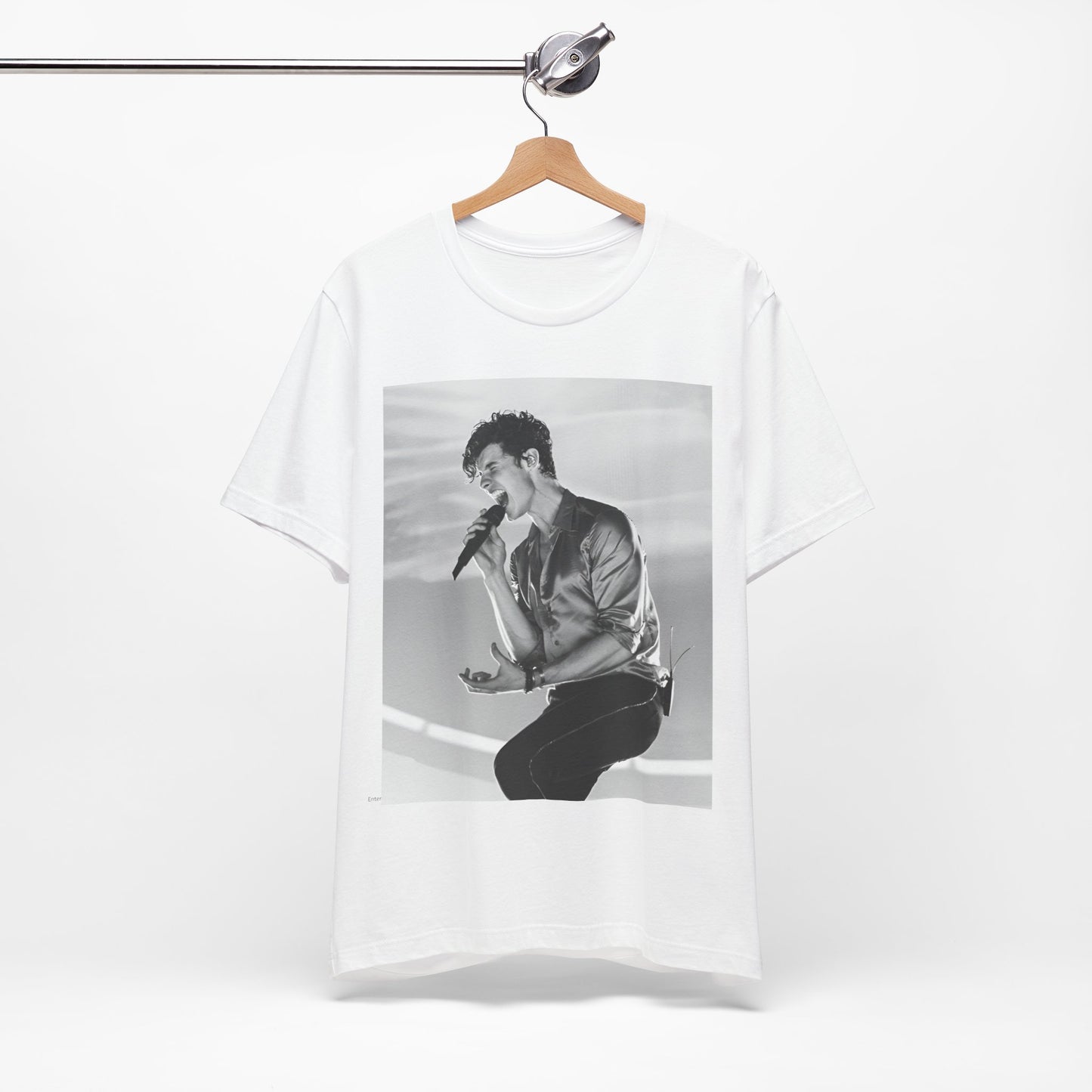 A black graphic t-shirt featuring a black and white graphic or photo of Shawn Mendes as a dreamy pop star.