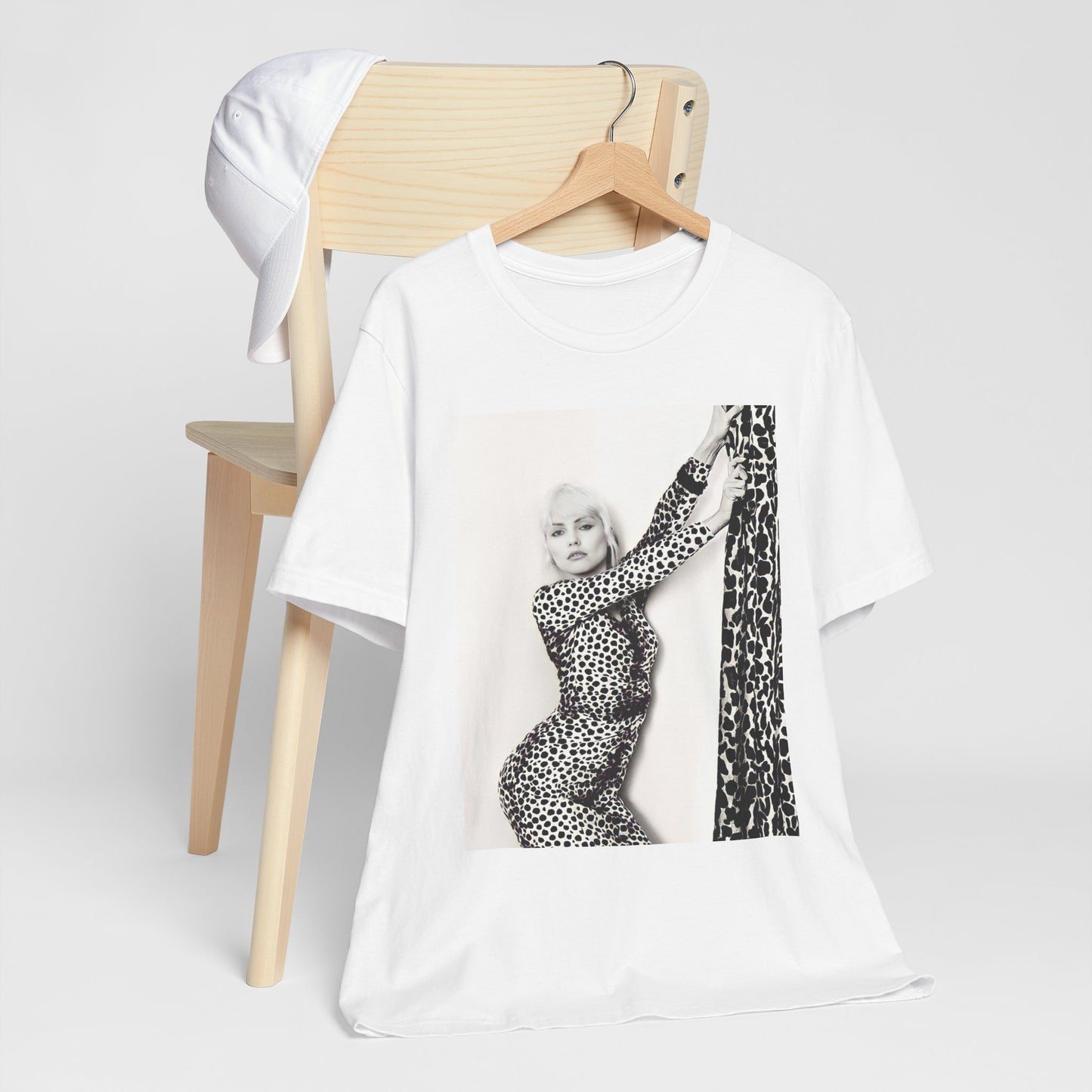 A black graphic t-shirt featuring a black and white, wild-style graphic of Blondie, emphasizing their untamed spirit.