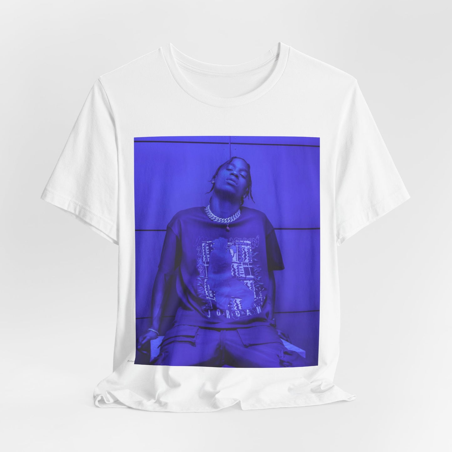 A black graphic t-shirt featuring a timeless trap star graphic of Travis Scott.