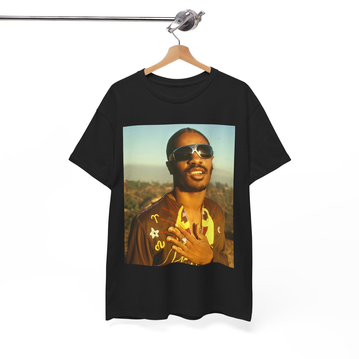 A black graphic t-shirt featuring a 70s cool musical genius graphic of Stevie Wonder.