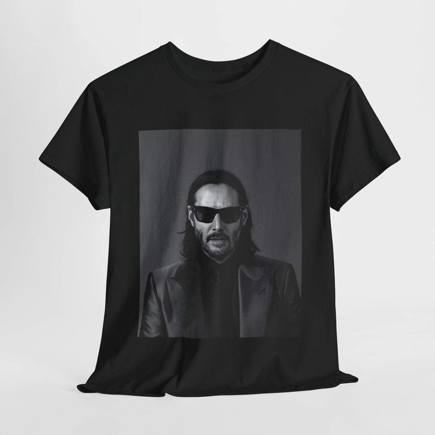 A black graphic t-shirt featuring an aesthetic graphic of Keanu Reeves as an action hero.