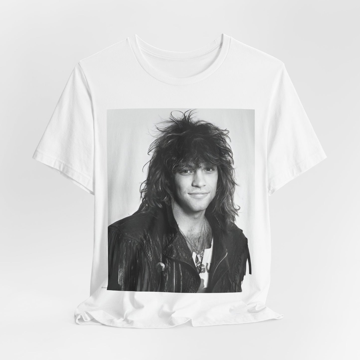 A black graphic t-shirt featuring a black and white photo of Bon Jovi from a 90s tour, performing on stage.