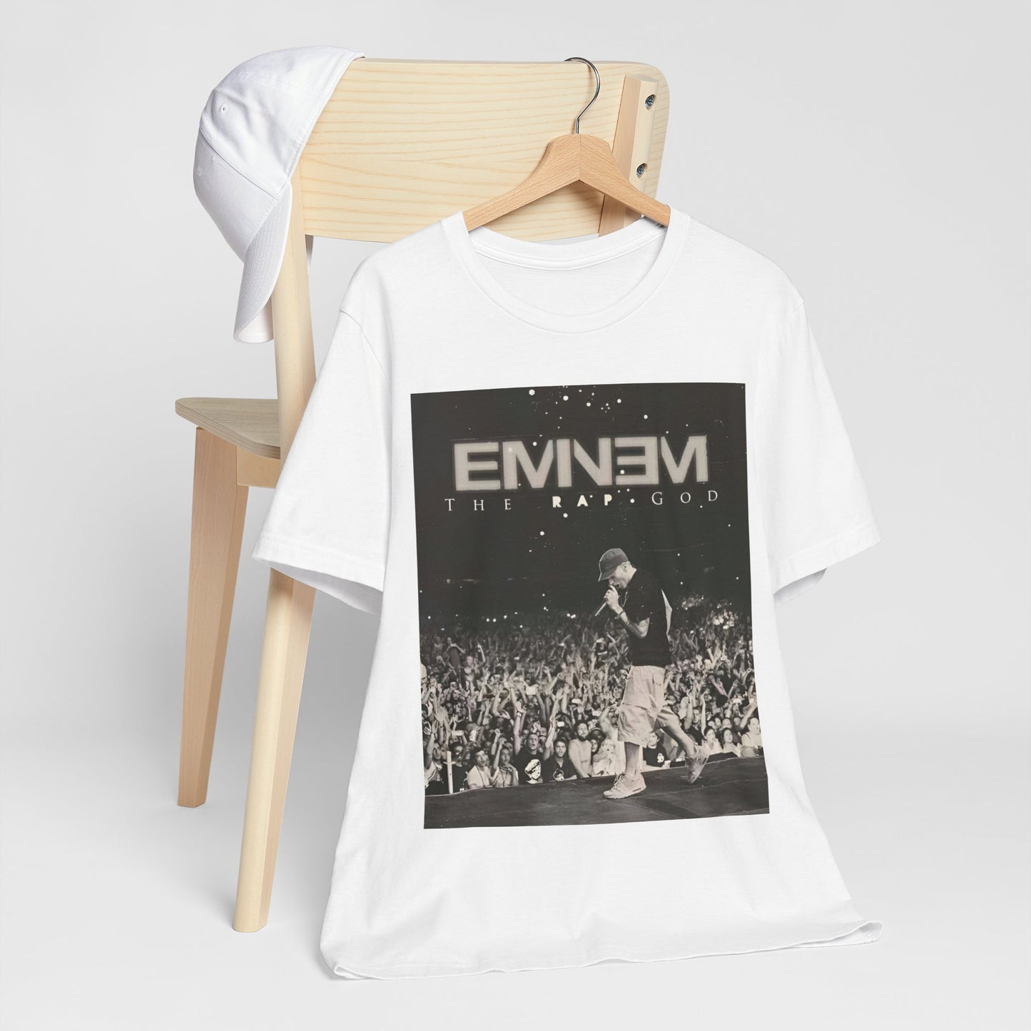 A black graphic t-shirt featuring a graphic or photo of Eminem performing live on tour.