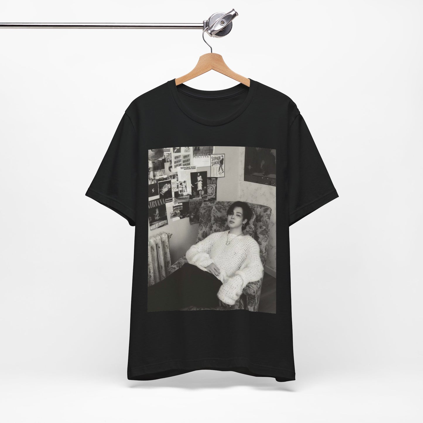 A black graphic t-shirt featuring a black and white portrait photo of Jimin.