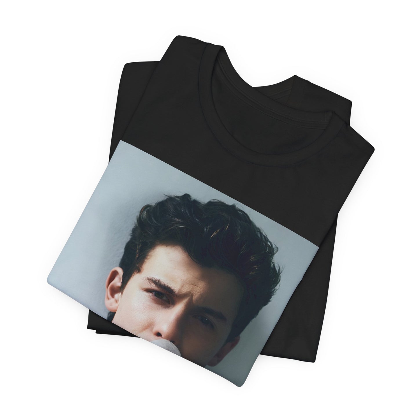 A black graphic t-shirt featuring a photo of Shawn Mendes with a fierce, confident gaze.