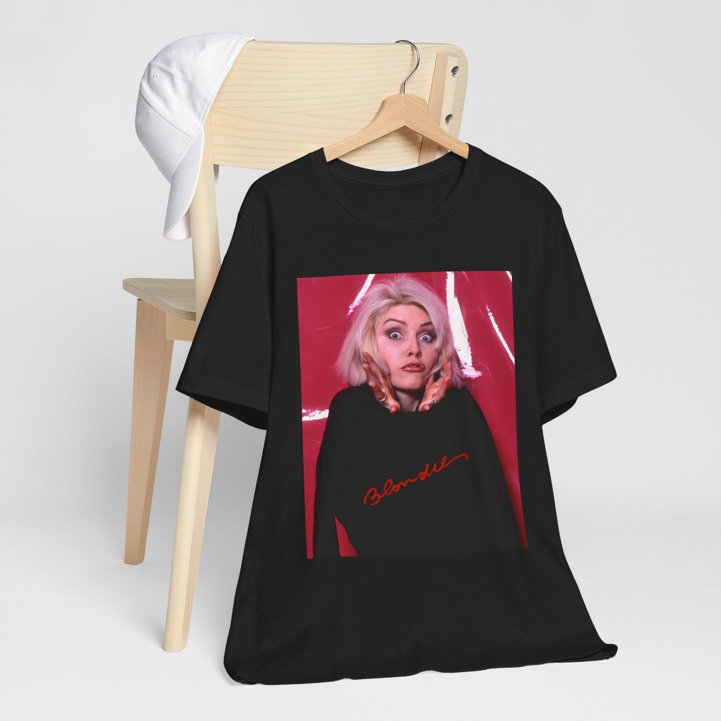 A black graphic t-shirt featuring a graphic related to Blondie's 'Atomic' song or era.