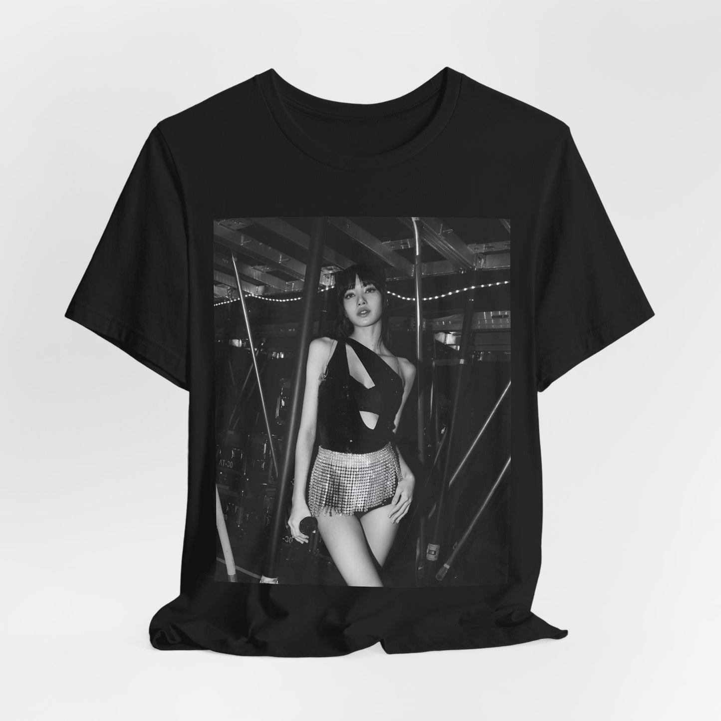 A black graphic t-shirt featuring a black and white graphic or photo of Lisa in a backstage setting.