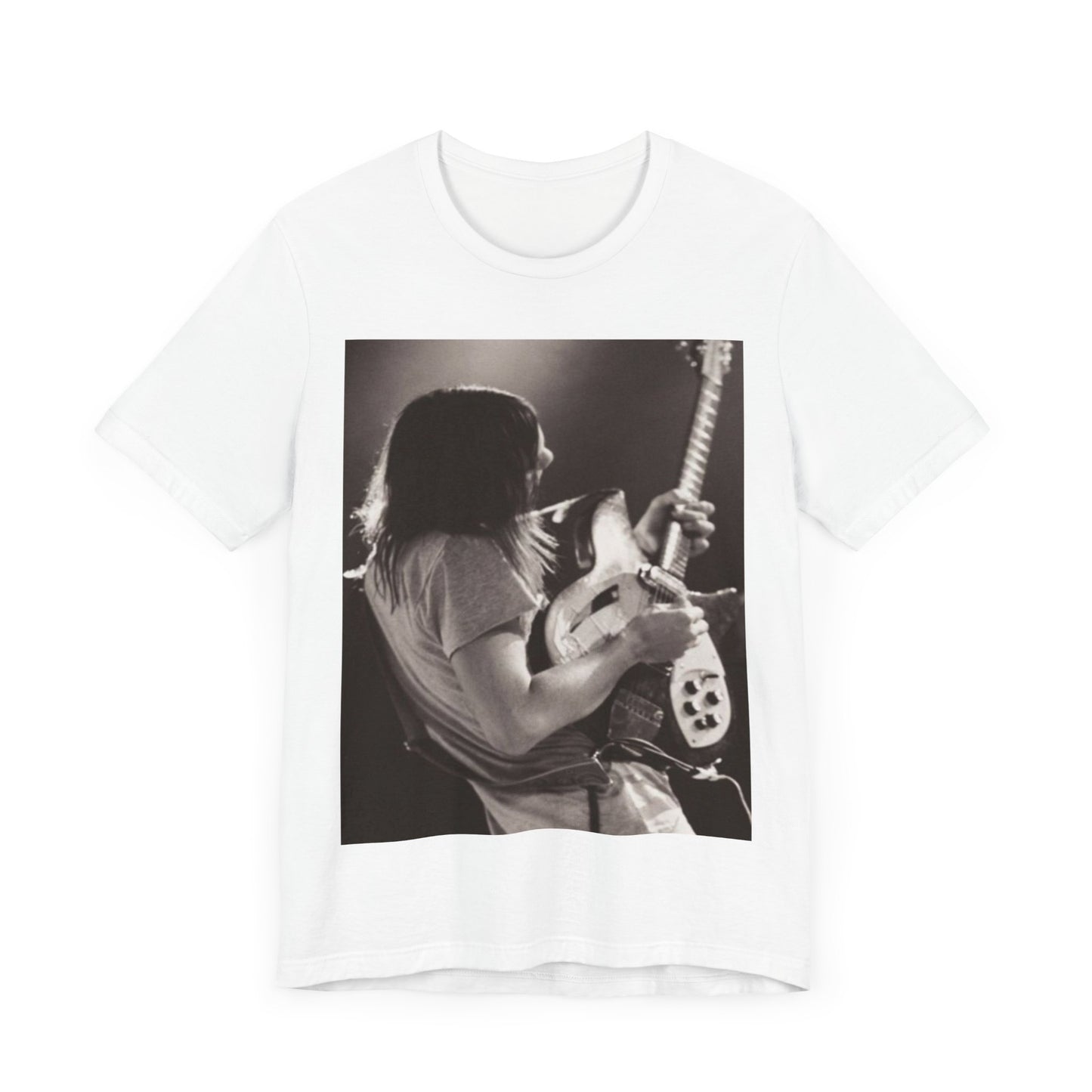 A black graphic t-shirt featuring a black and white graphic or photo of Tame Impala performing live on stage.