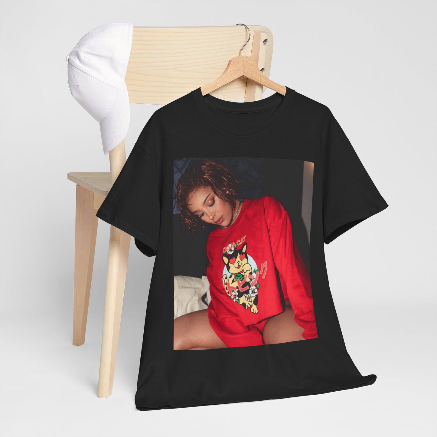 A black graphic t-shirt featuring a graphic of Doja Cat as a style icon.
