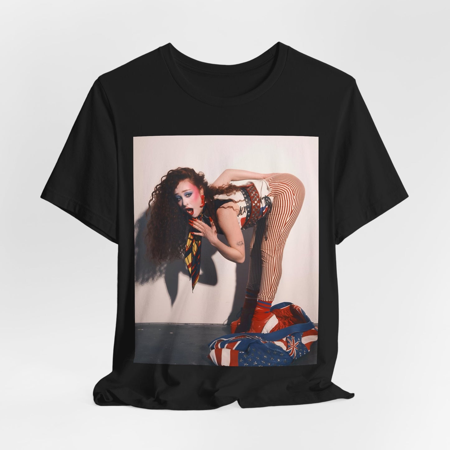 A black graphic t-shirt featuring a graphic of Chappell Roan with a 'Hot to Go!' theme, emphasizing her drag icon persona.