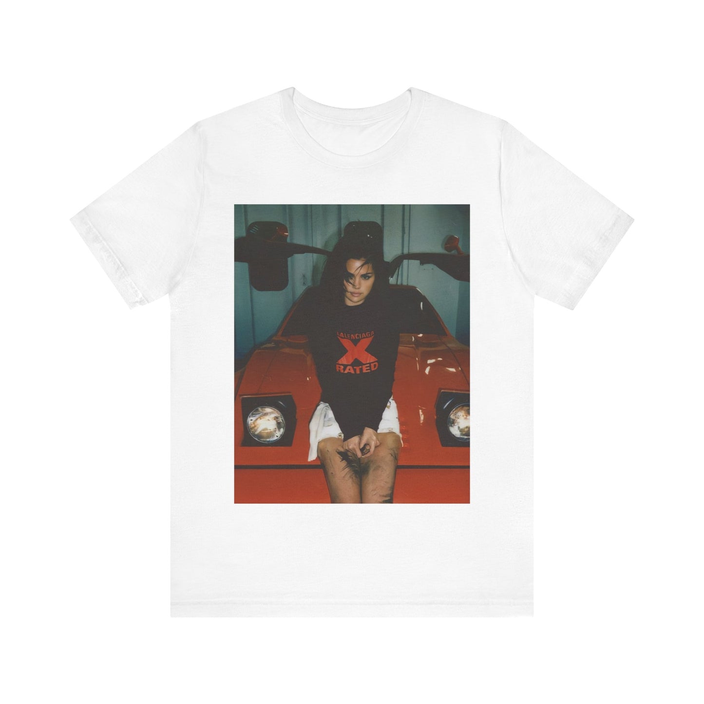A black graphic t-shirt featuring a photo or graphic of Selena Gomez with a car, designed with an 'X Rated' or edgy aesthetic.
