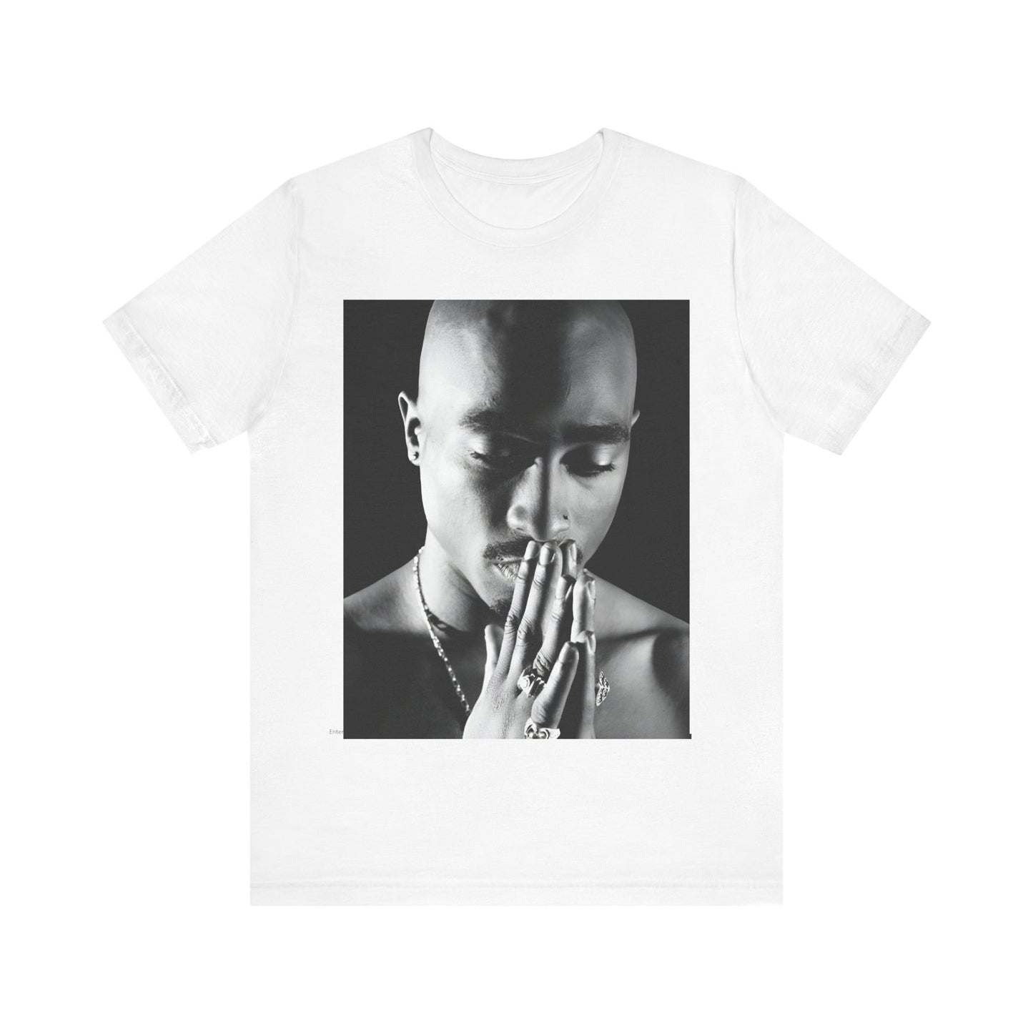 A black graphic t-shirt featuring a black and white streetwear rebel graphic of Tupac.