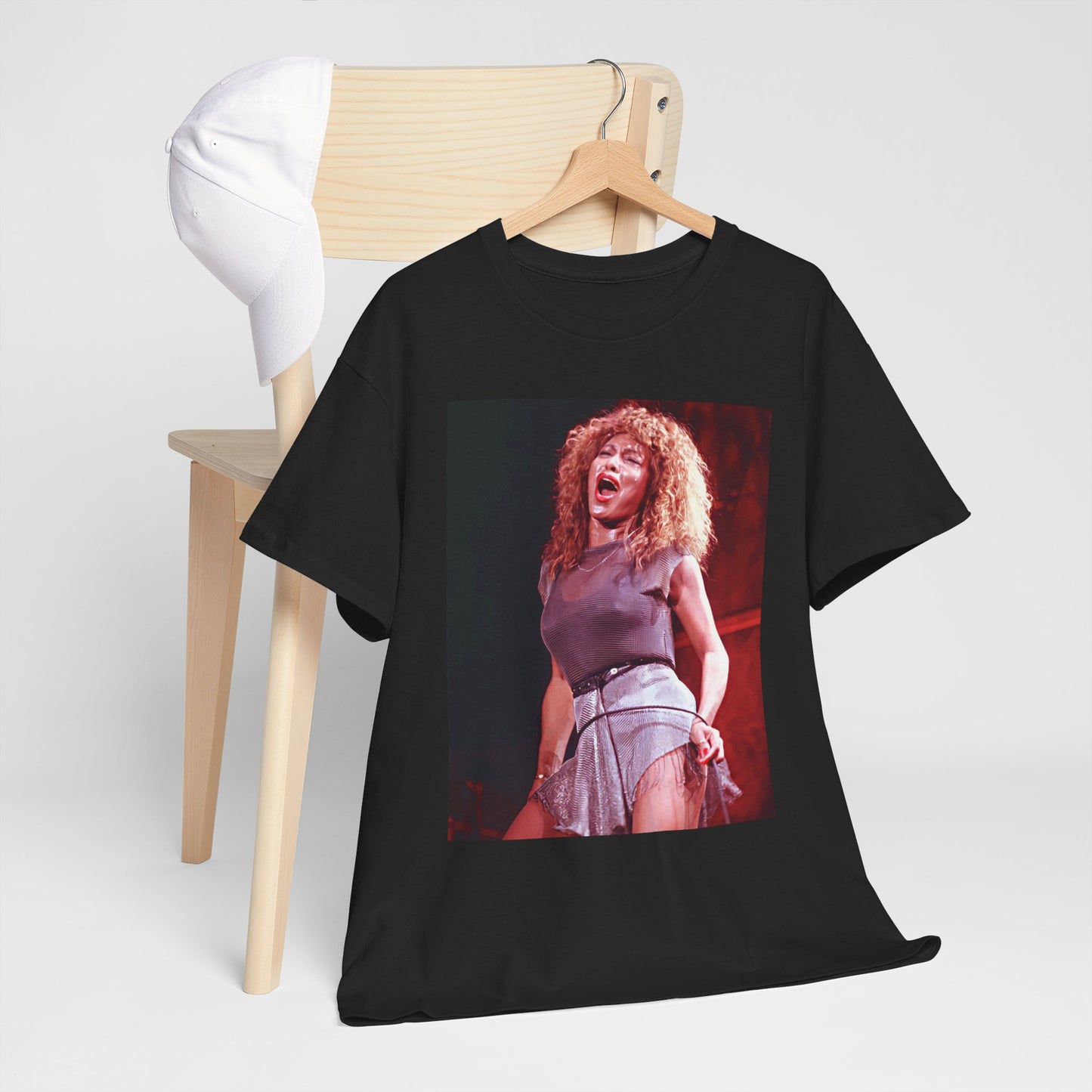 A black graphic t-shirt featuring a graphic of Tina Turner's iconic hair style.