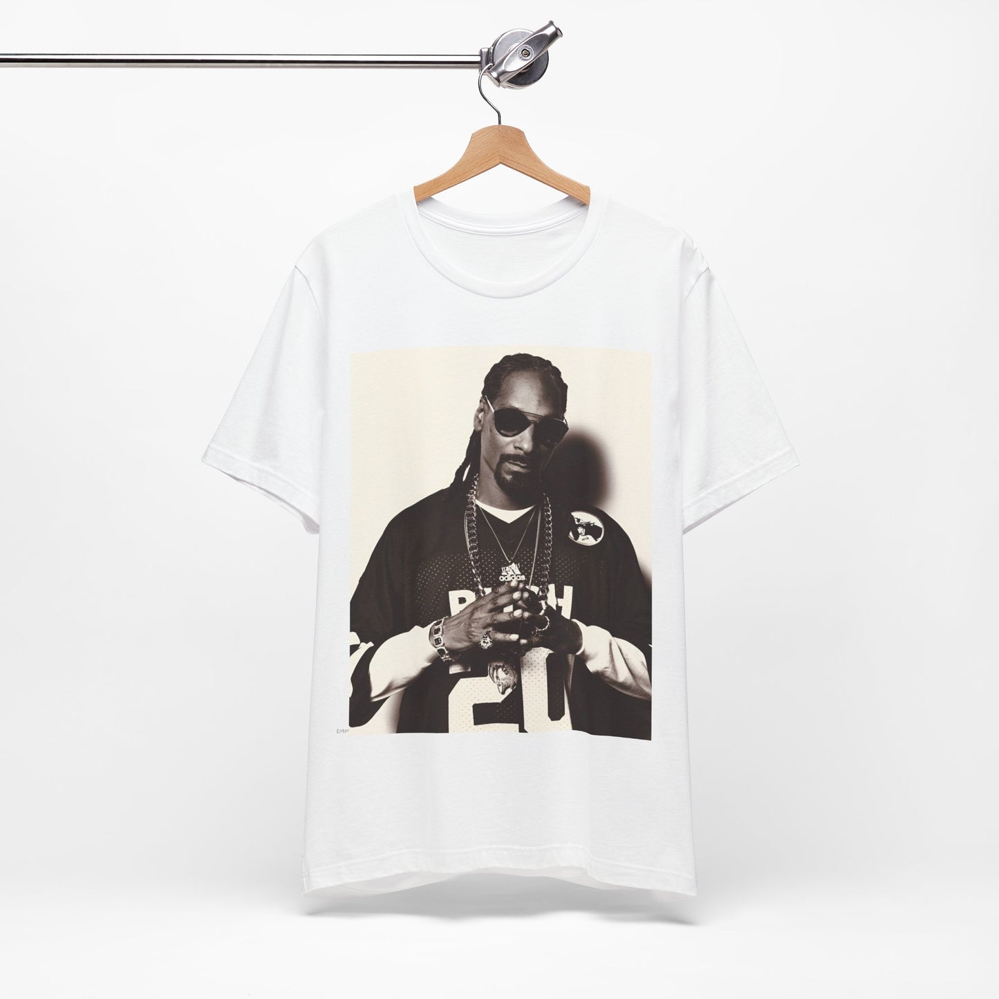 A black graphic t-shirt featuring a black and white, monochrome graphic or photo of Snoop Dogg in an OG style.
