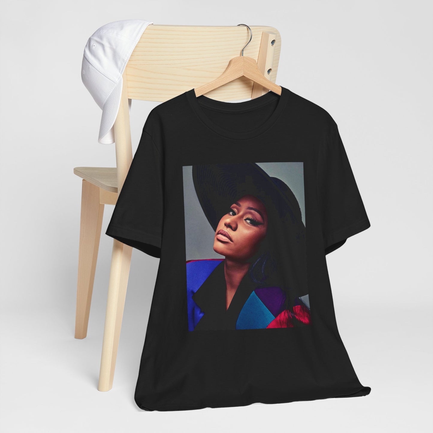 A black graphic t-shirt featuring a graphic of Nicki Minaj as a streetwear icon.