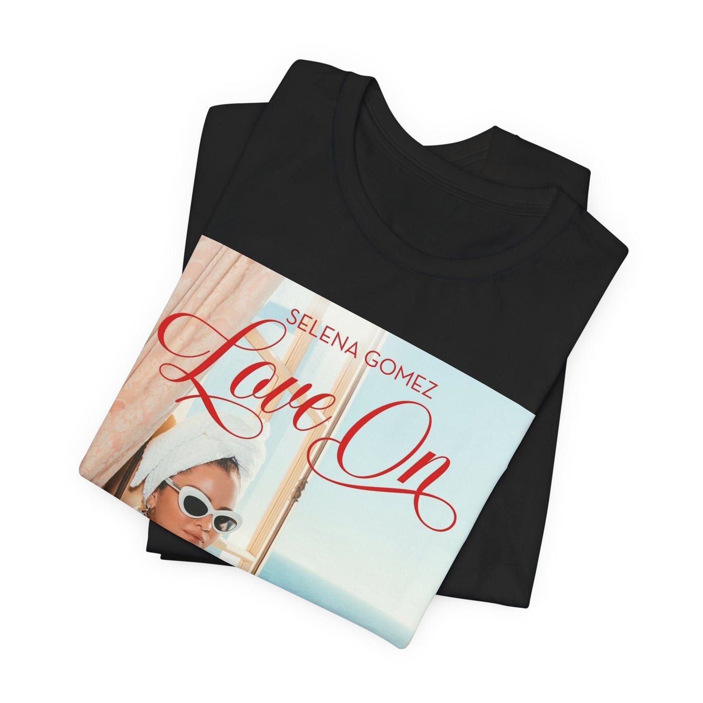 A black graphic t-shirt featuring a graphic related to Selena Gomez's 'Love On' song.