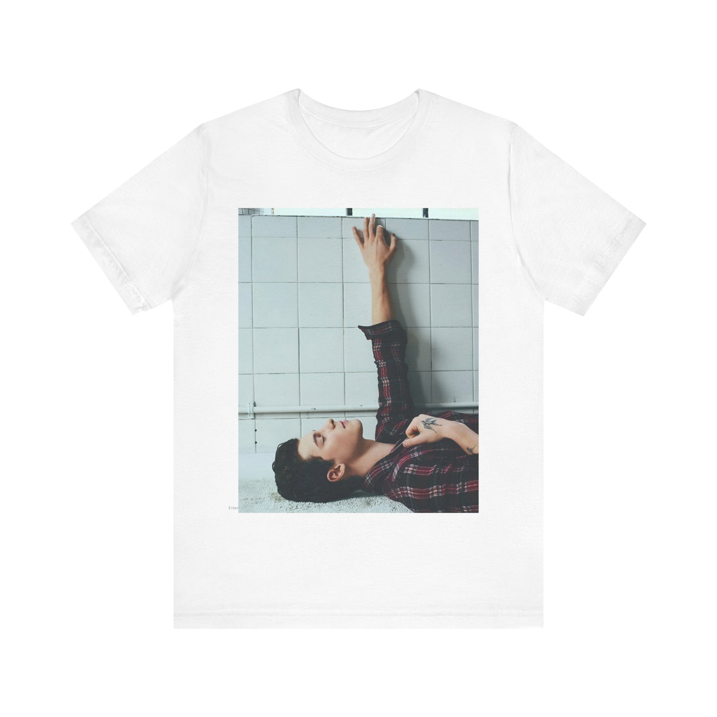 A black graphic t-shirt featuring a bold graphic of Shawn Mendes as a superstar.