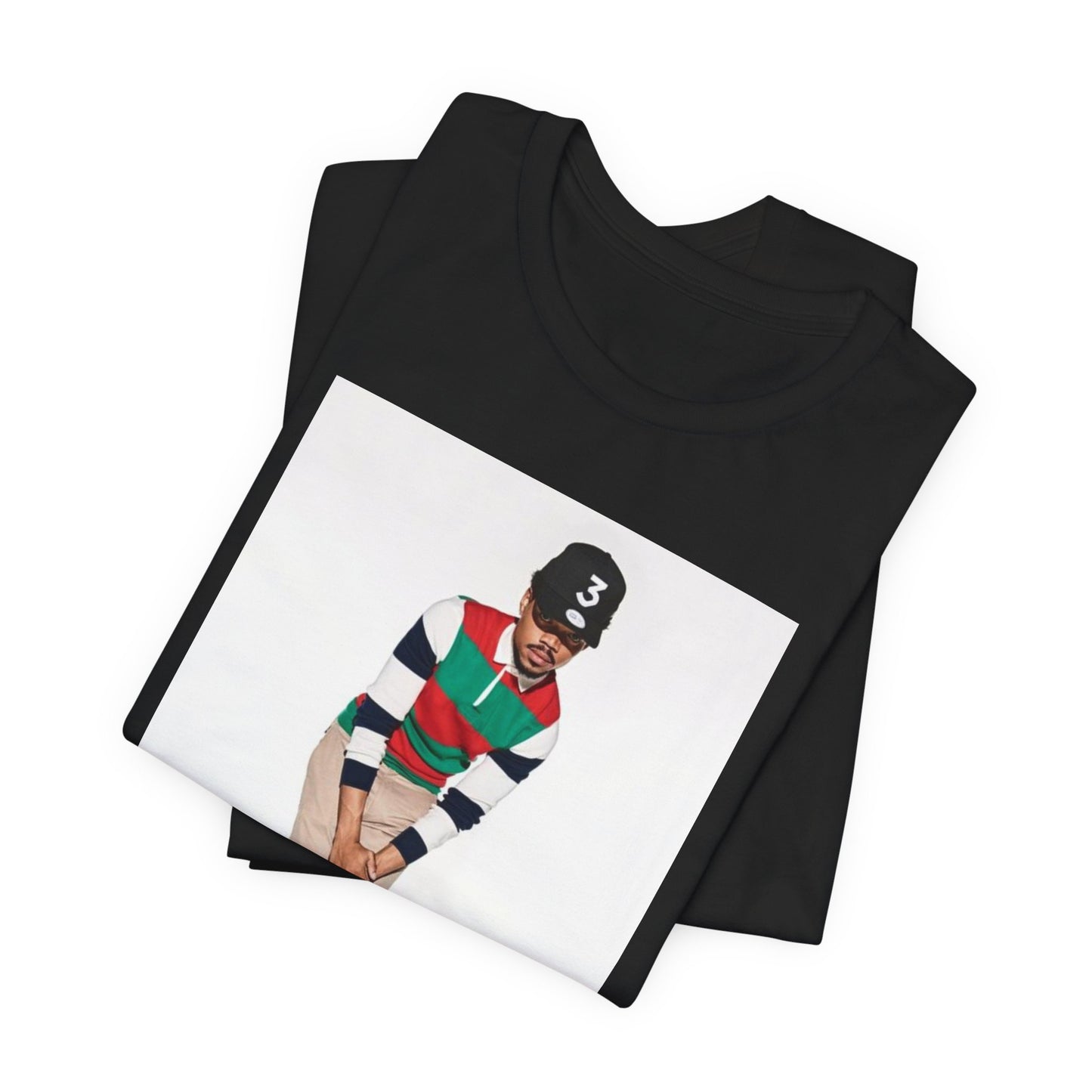 A black graphic t-shirt featuring a graphic of Chance the Rapper with a positive or 'feel good' hip hop vibe.