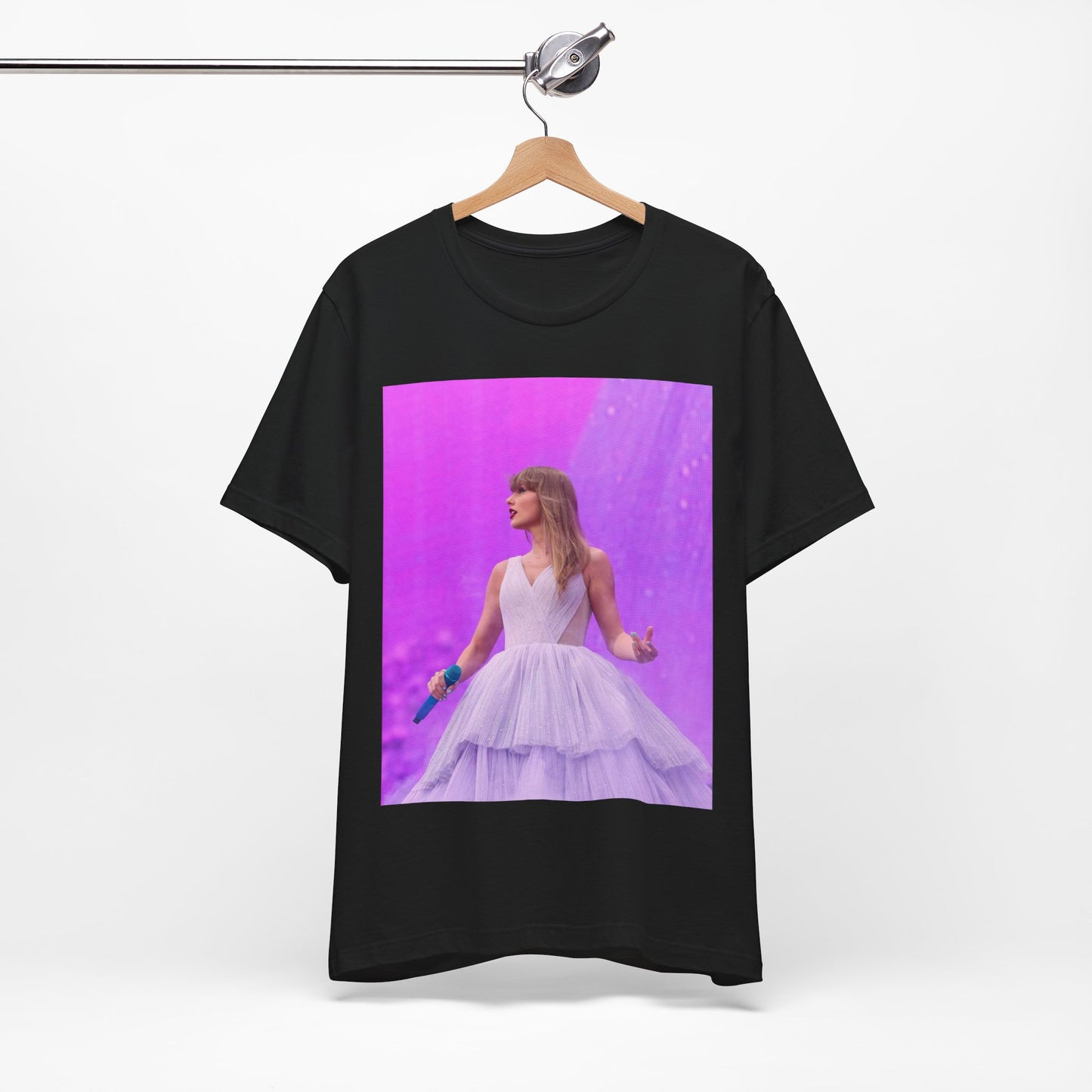 A black graphic t-shirt featuring a graphic or photo of Taylor Swift performing live on stage.