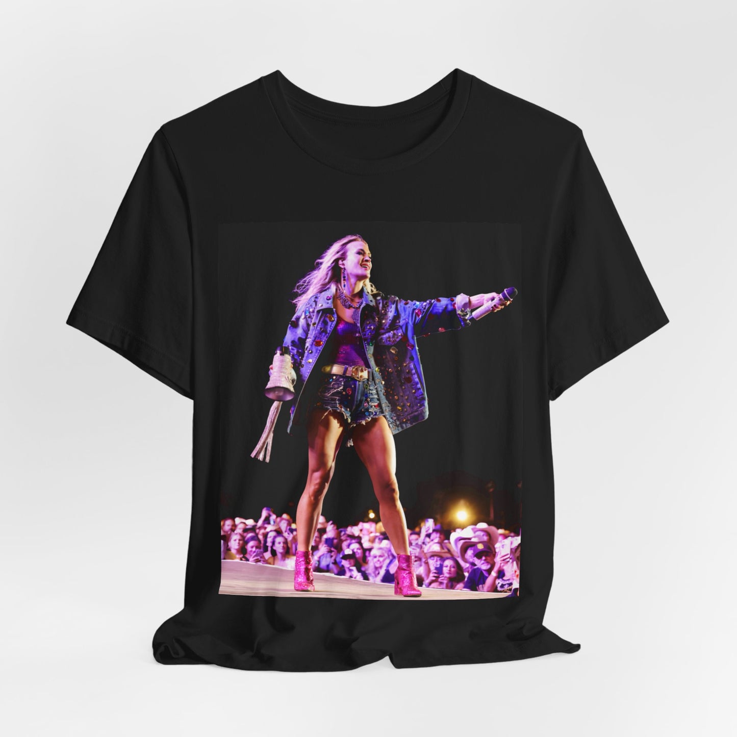 A black graphic t-shirt featuring a graphic of Carrie Underwood with Nashville-themed elements or skyline.