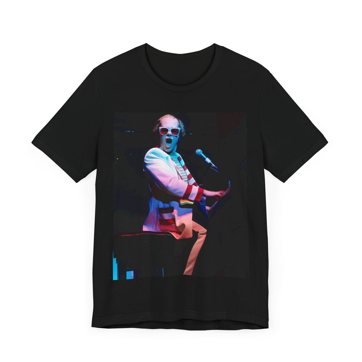 A black graphic t-shirt featuring a photo of Elton John performing live on stage at his piano.