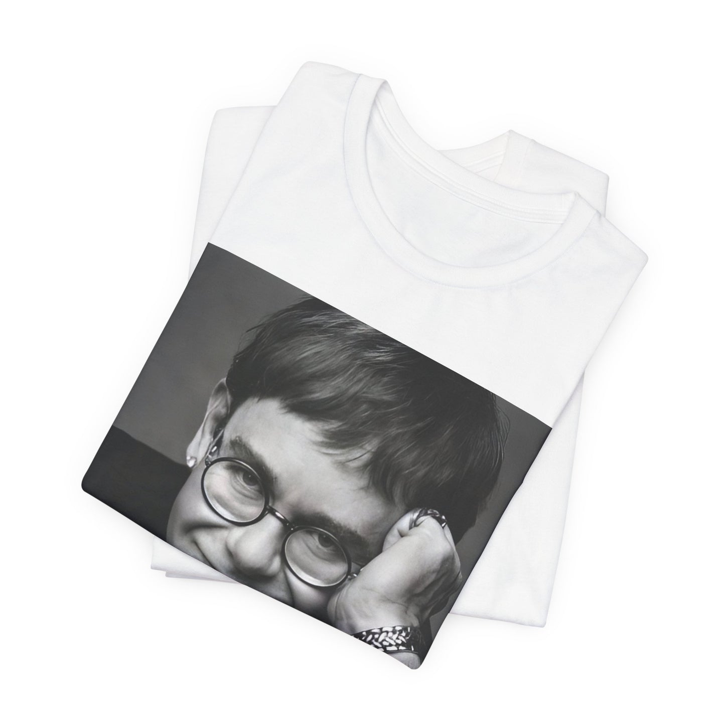 A black graphic t-shirt featuring a retro black and white photo portrait of Elton John.