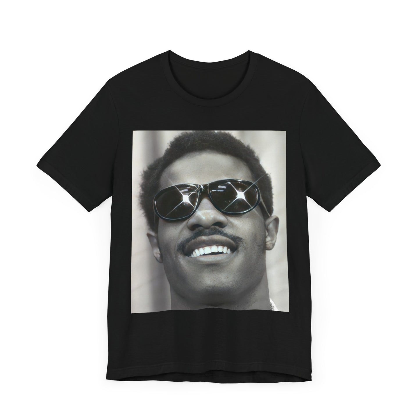 A black graphic t-shirt featuring a 70s funk aesthetic black and white graphic or photo of Stevie Wonder.