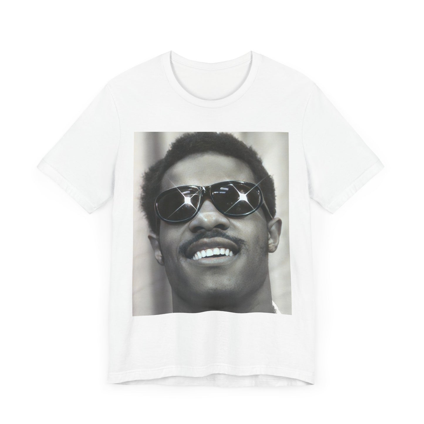 A black graphic t-shirt featuring a 70s funk aesthetic black and white graphic or photo of Stevie Wonder.