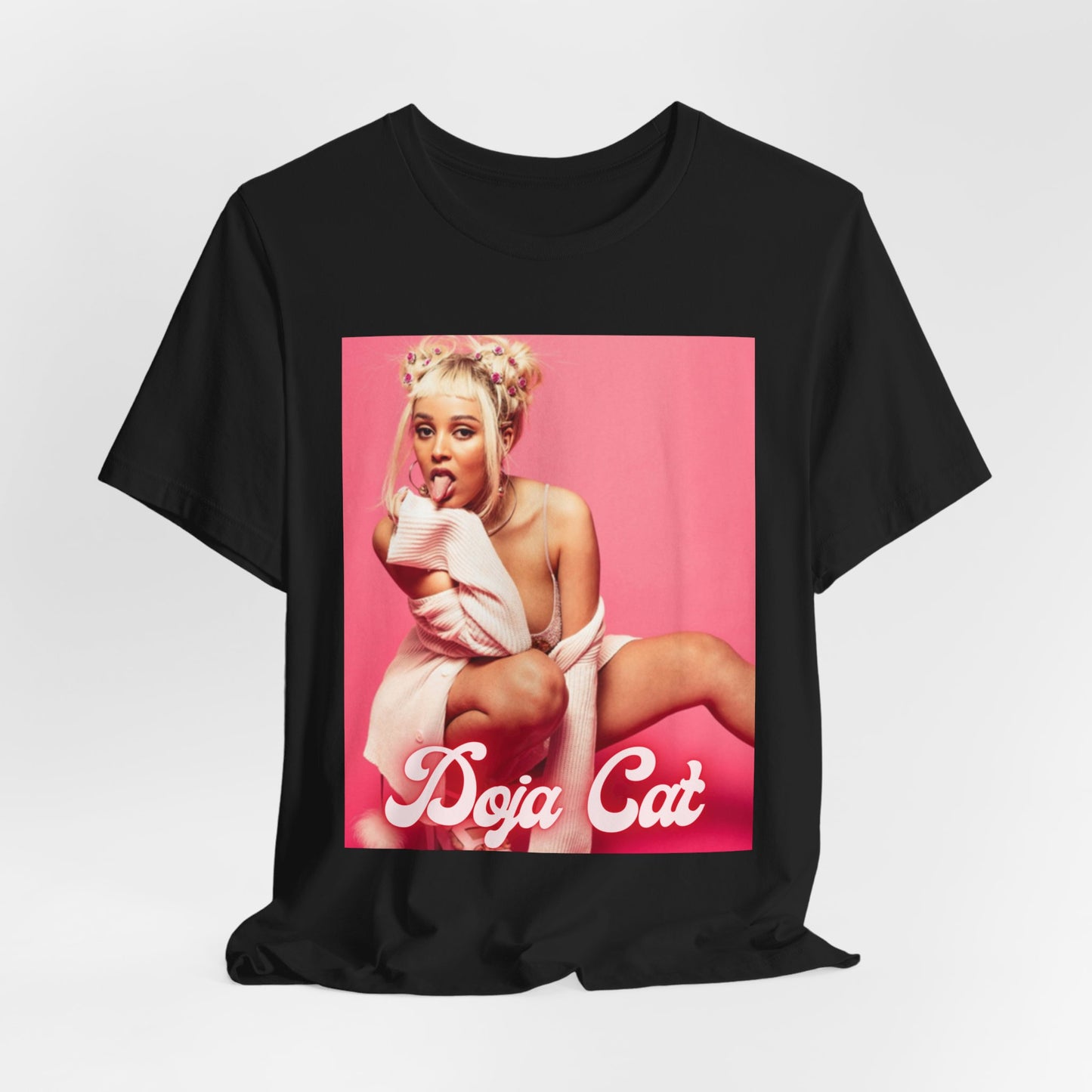 A black graphic t-shirt featuring a graphic related to Doja Cat's 'Woman' song or era.