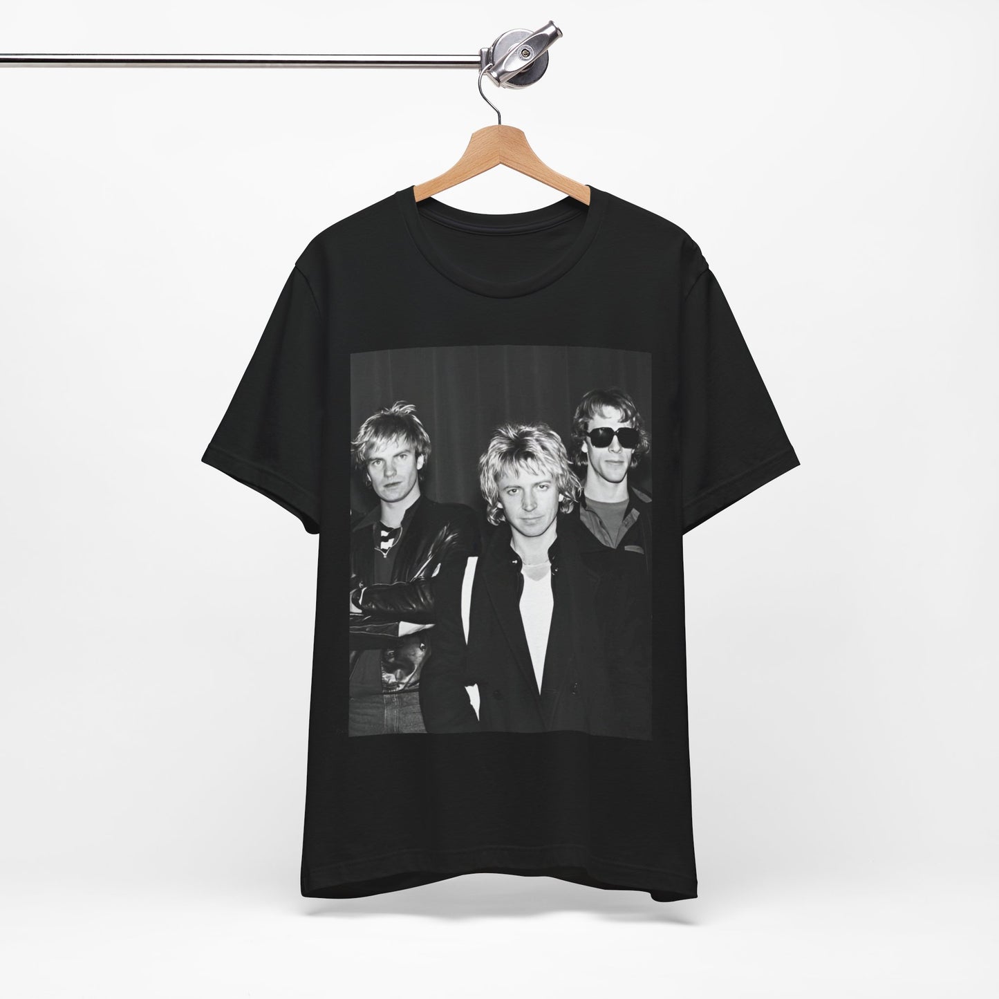 A black graphic t-shirt featuring a black and white, monochrome graphic or photo of The Police.