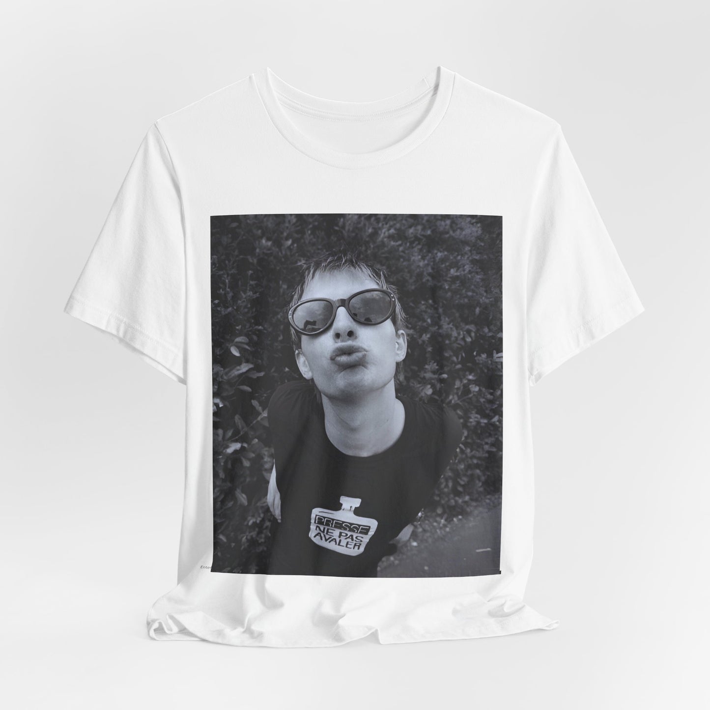 A black graphic t-shirt featuring a retro 90s graphic of Thom Yorke from Radiohead.